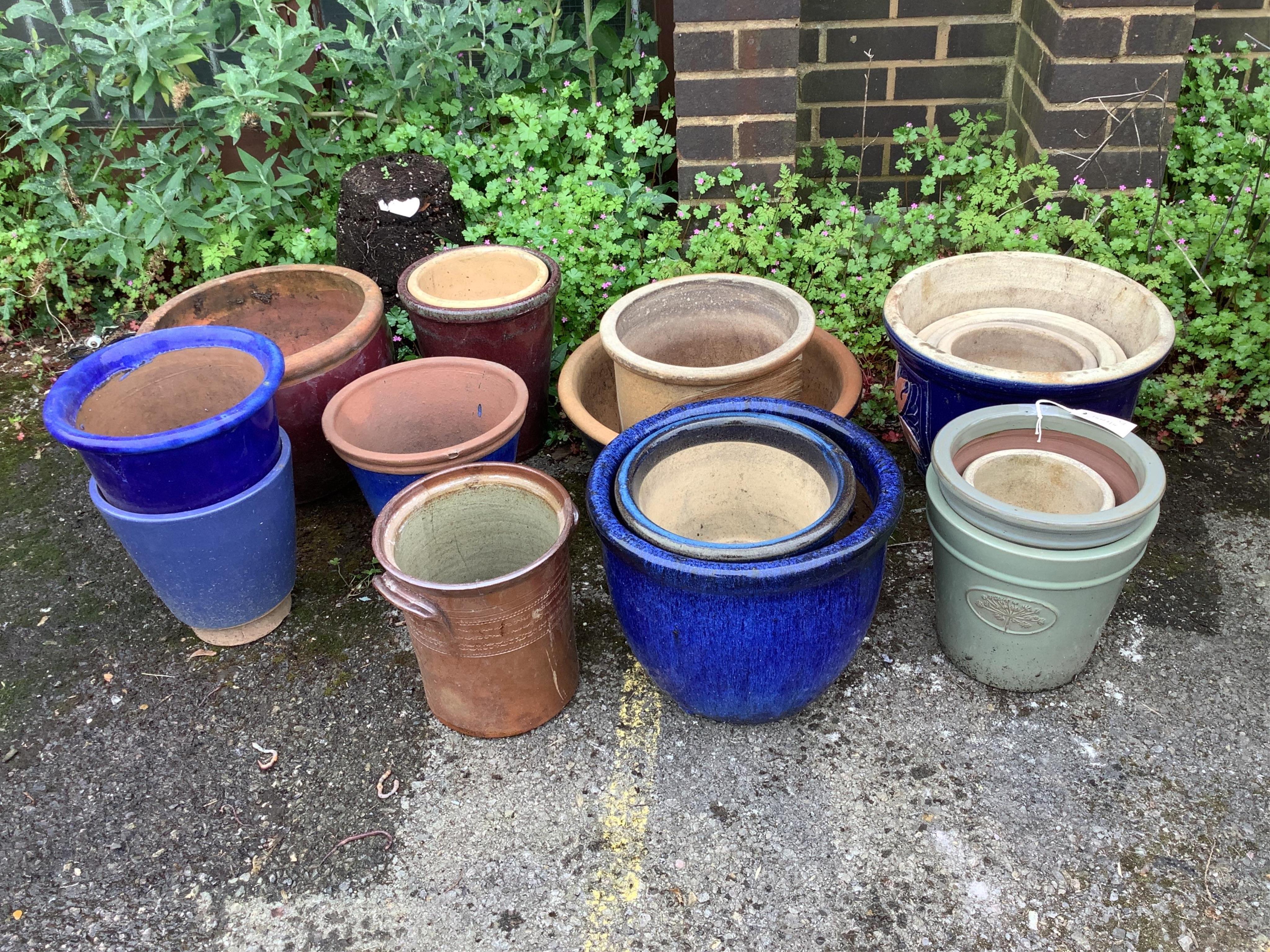 Eighteen assorted glazed earthenware garden planters, largest diameter 38cm, height 30cm